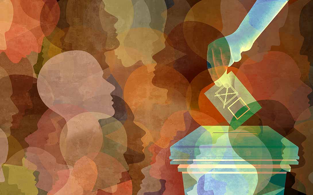 Illustration of a patchwork of profile silhouettes in different colors. A hand drops a filled ballot into a box.
